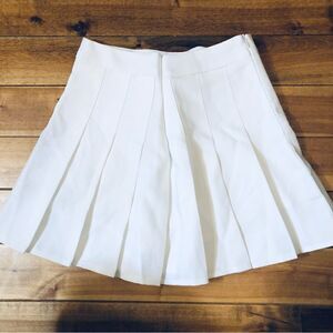White pleated skirt with shorts under